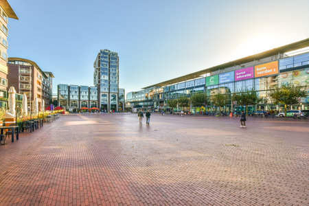 a city street with people walking on the sidewalks and buildings in the background, taken from a low angleのeditorial素材