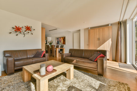 Amsterdam, Netherlands - 10 April, 2021: a living room with two couches and a coffee table in front...