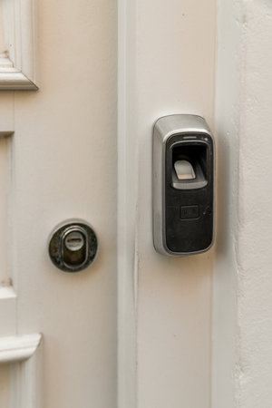 Amsterdam, Netherlands - 10 April, 2021: an open door with a key in the lock and two keys attached to the side of the door that is closedのeditorial素材