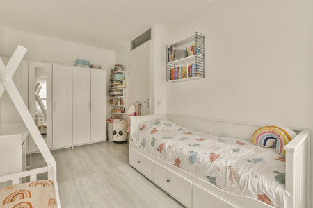 Amsterdam, Netherlands - 10 April, 2021: a kids room with white walls and wooden flooring, including a single bed in the center of the roomのeditorial素材