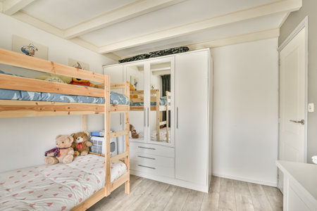 Amsterdam, Netherlands - 10 April, 2021: a childs room with bunks and other items on the floor in front of the bed, there is a teddy bearのeditorial素材