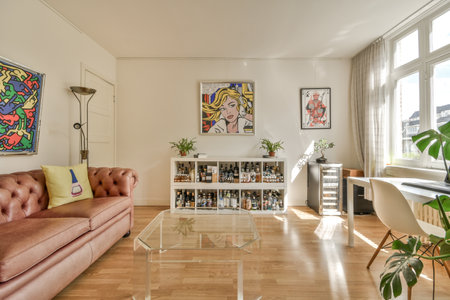 Amsterdam, Netherlands - 10 April, 2021: a living room with wood flooring and pink couch in the...