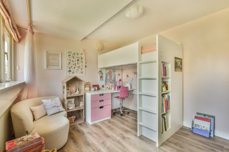a kids room with a desk, chair and bookshel in the corner next to the bunk bedのeditorial素材