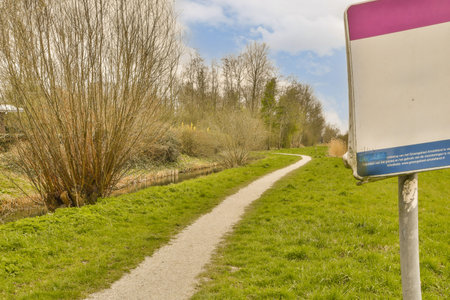 a sign on the side of a path that is not in use, but its very nice to seeの写真素材