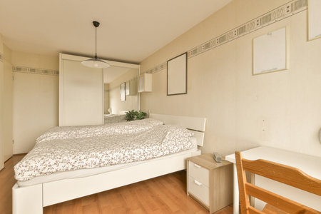 a bedroom with a bed, desk and mirror on the wall next to each other rooms closets