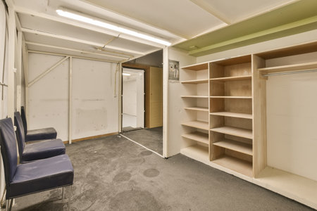 a room that is being used for storage and other things to be stored on the wall in the closet area