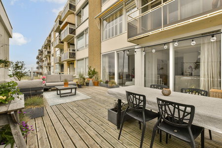 an outdoor living area with patio furniture and large sliding glass doors that open up to the...