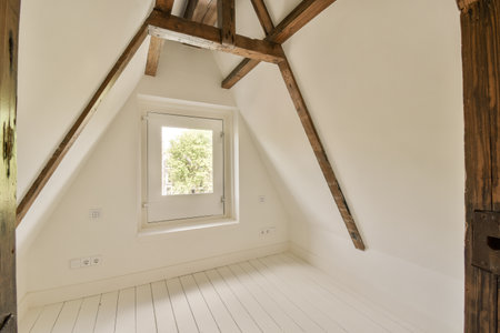 an attic style room with white wood flooring and exposed wooden beams on the ceiling above it is a...