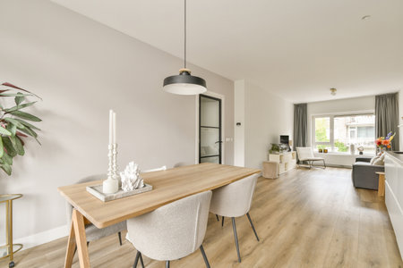 Charming modern interior featuring a stylish dining area with a minimalist table, elegant chairs,...