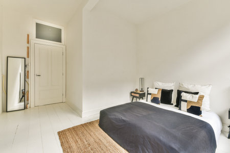 A modern minimalist bedroom featuring neutral colors, clean lines, and functional furniture that...