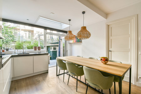 A sleek, modern kitchen featuring minimalistic design elements, natural light, and an inviting...