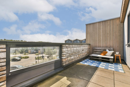 A contemporary rooftop terrace featuring stylish furniture and a scenic view, perfect for relaxation and social gatherings with a blend of comfort and aesthetics.の写真素材