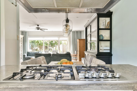 An inviting modern kitchen featuring a sleek gas stove, elegant cabinetry, and a spacious open...