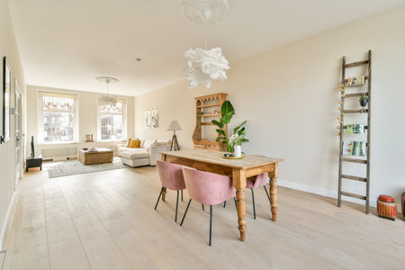 A beautifully designed modern living room featuring minimalistic decor, a wooden table, stylish...