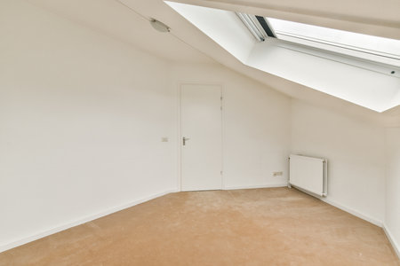 A spacious interior featuring soft light pouring through a skylight, showcasing a clean, uncluttered...