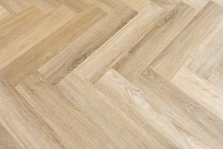 This image showcases a sophisticated wooden floor with a subtle natural grain pattern, highlighting the beauty of craftsmanship in interior design.の写真素材