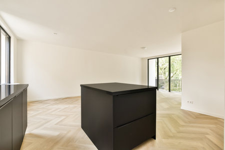 A spacious modern interior showcasing minimalistic design elements, featuring light-colored walls and stylish furniture that enhance the airy atmosphere.の写真素材