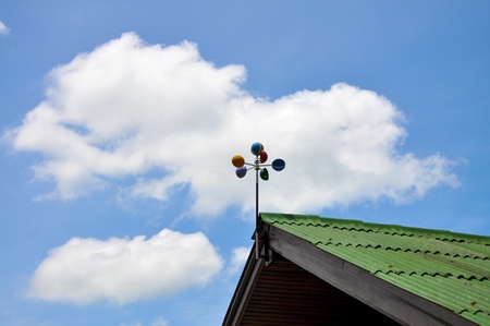 Wind turbine on roof and blue skyの写真素材