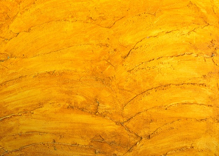 Cement background with a texture of a orange wallの写真素材