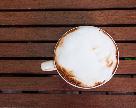 coffee cup on brown table.の写真素材