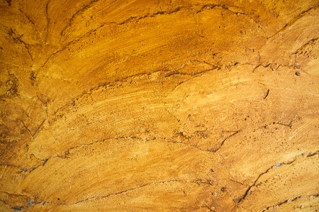 Cement background with a texture of a orange wallの写真素材