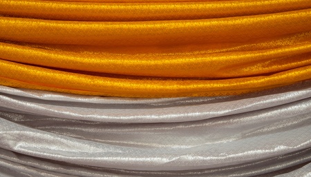 Gold curtains cover the table in Thailand.の写真素材