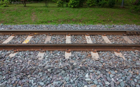 Thailand railway with grass and rockの写真素材