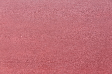 Cement background with a texture of red wall の写真素材