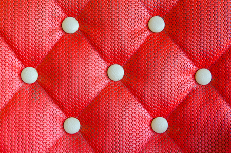 Red sofa upholstery leather pattern background.の写真素材