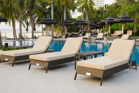 Beach chairs near swimming poolのeditorial素材