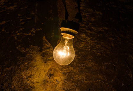 old light bulb in cave.の写真素材
