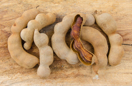 Sweet tamarind on wood plank.の写真素材