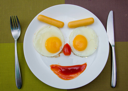 Happy Face Frying Eggs breakfastの写真素材