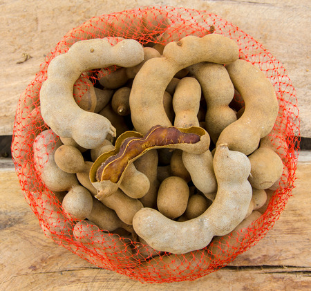 Sweet tamarind on wood plank.の写真素材