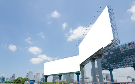 large blank billboard on road with city view backgroundのeditorial素材