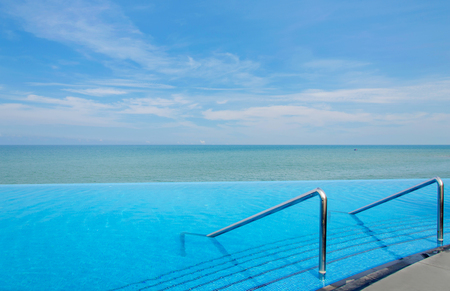 Luxury swimming pool in front of the sea.のeditorial素材