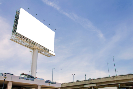 large blank billboard on road with city view backgroundの写真素材