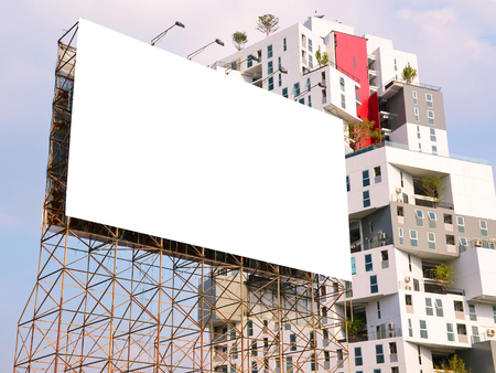 large blank billboard on road with city view backgroundのeditorial素材