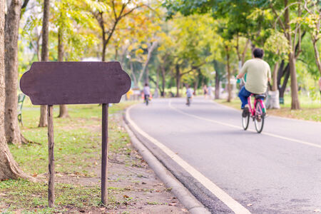 exercise with bicycle in public parkの写真素材