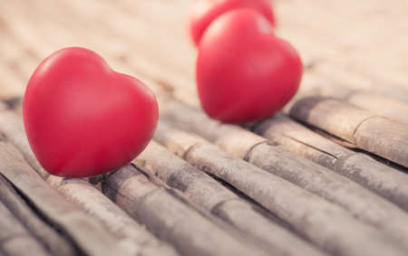 Red heart in love of Valentine's day with wood background.の写真素材
