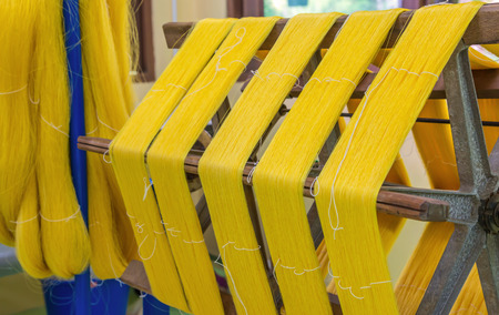 Weaving loom and shuttle on the warp.