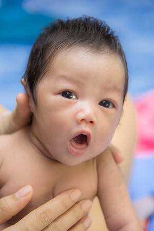 Portrait of cute newborn baby girl.の写真素材