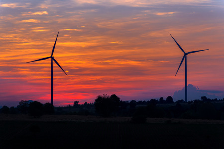 Eco power in wind turbine farm with sunset.の写真素材