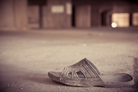 old slippers or shoe in an abandoned building.の写真素材