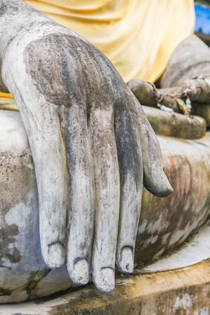 Hand of an ancient Buddha image at Ayutthaya temple, Thailand .の写真素材