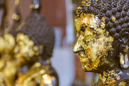 Closeup of Buddha statue gilded in the measure.の写真素材