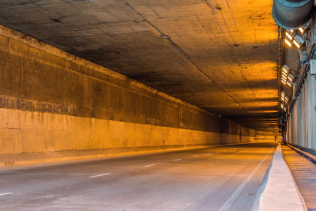 highway road tunnel with light coming from the exit.の写真素材