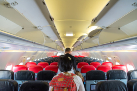 Blurred of interior aircraft with passengers, airplane cabins blur.の写真素材