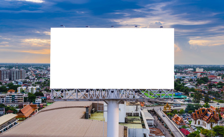 large blank billboard with city view background.の写真素材
