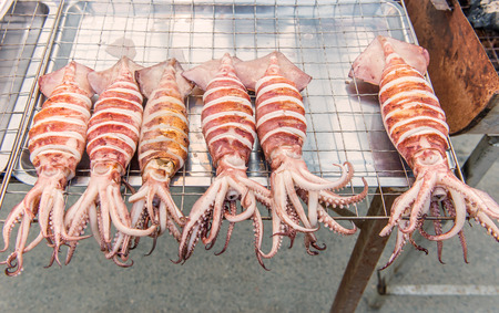 Grilled Squid or seafood on a market stall.